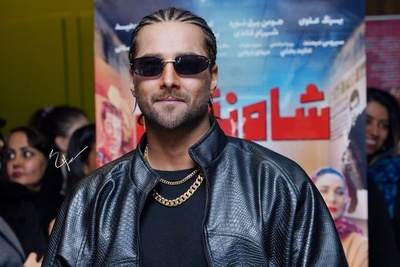 استایل امیر مقاره در اکران مردمی «شاه‎ نقش» که همه نگاه‌ها رو به سمت خودش جلب کرد؛ ترکیب شلوار راه راه با کت چرم و موهایی بافته شده! +ویدیو