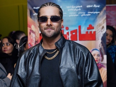 استایل امیر مقاره در اکران مردمی «شاه‎ نقش» که همه نگاه‌ها رو به سمت خودش جلب کرد؛ ترکیب شلوار راه راه با کت چرم و موهایی بافته شده! +ویدیو